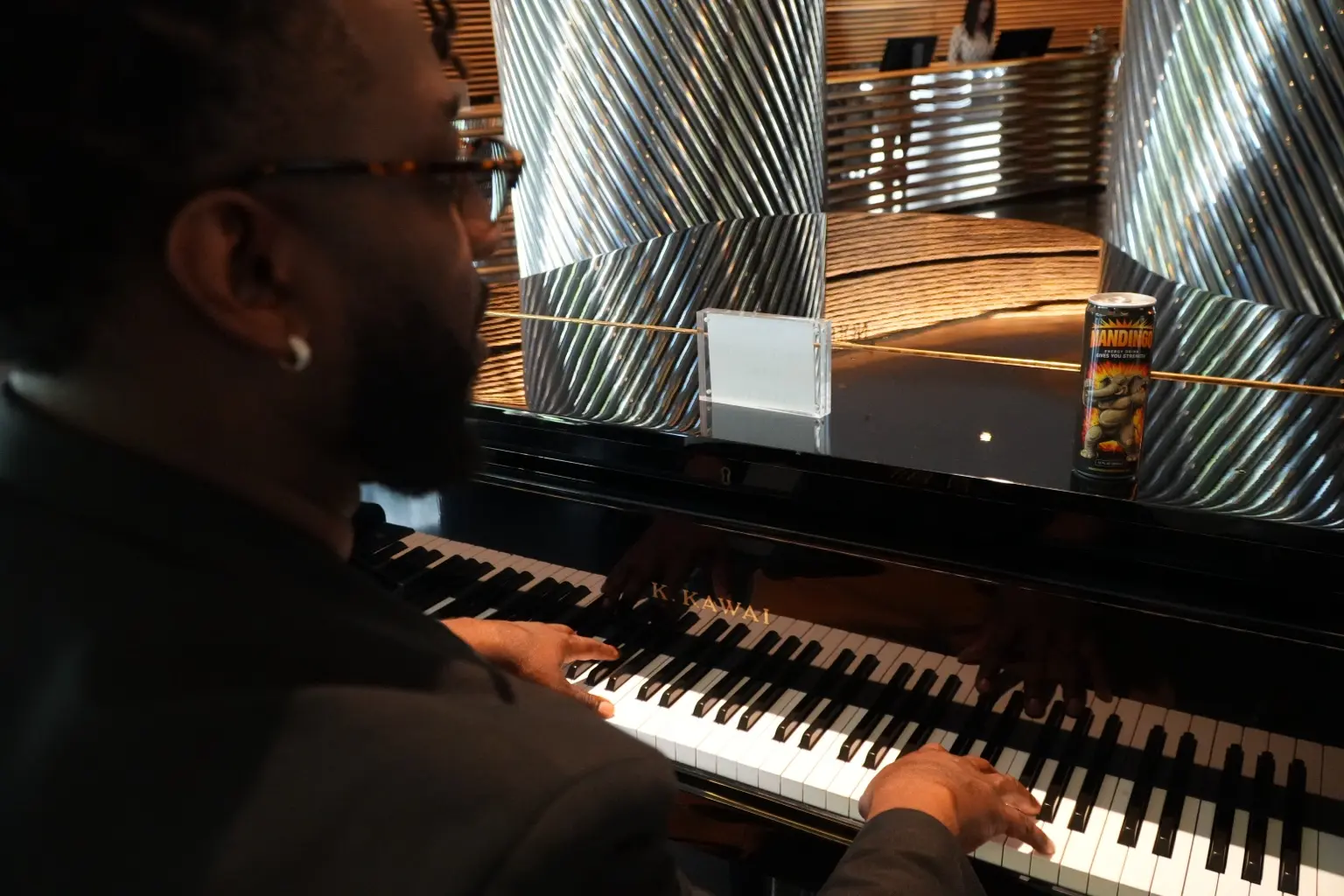 Musician at a piano with a Mandingo Original can